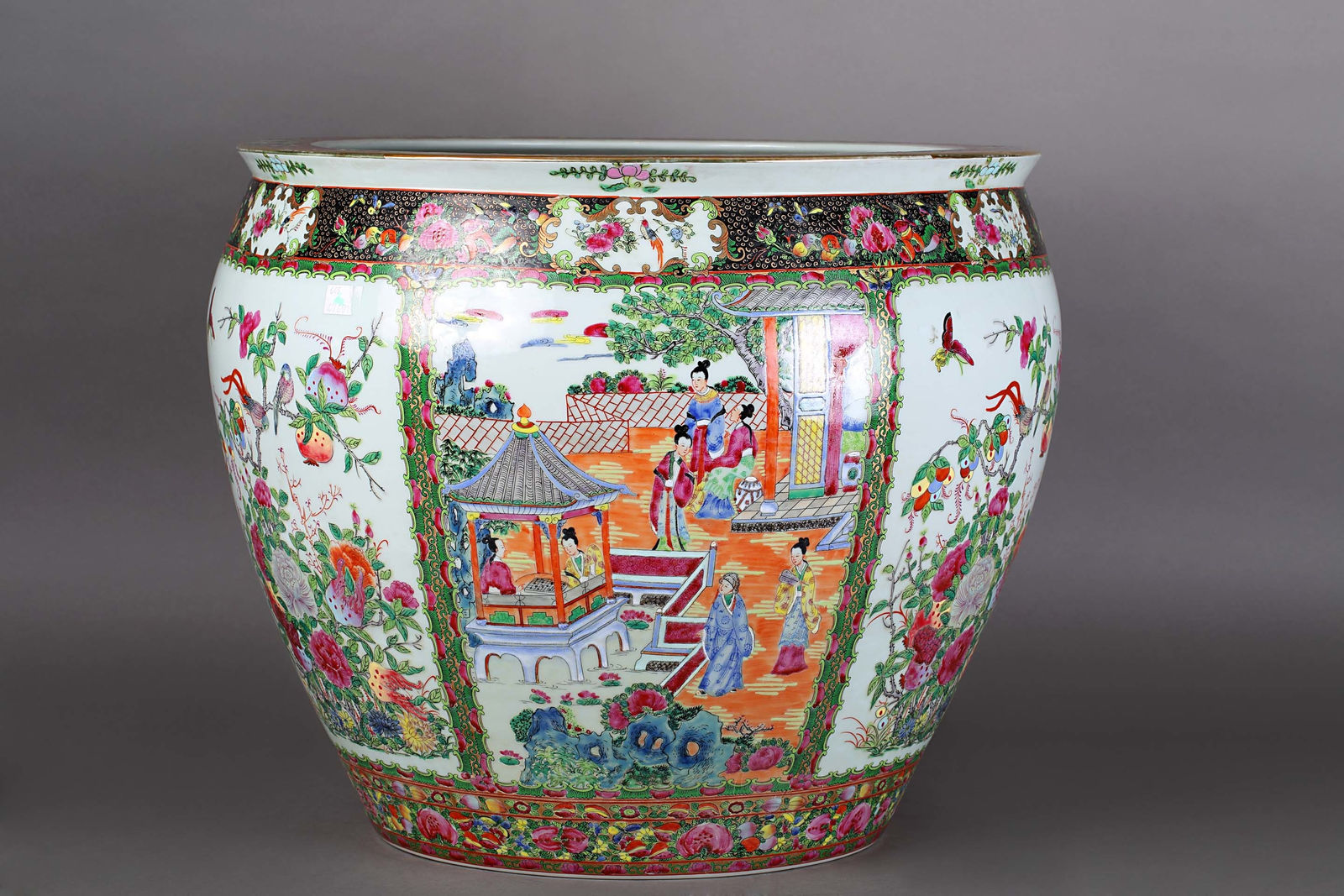 Large porcelain cache pot with floral and figurative motifs