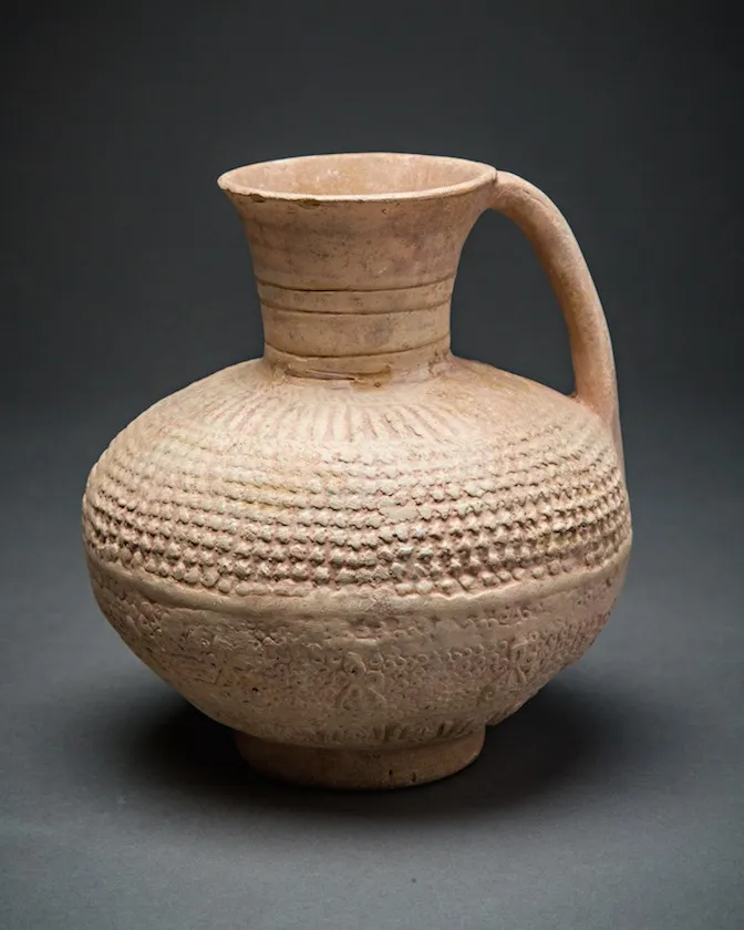 Globular unglazed terracotta jug