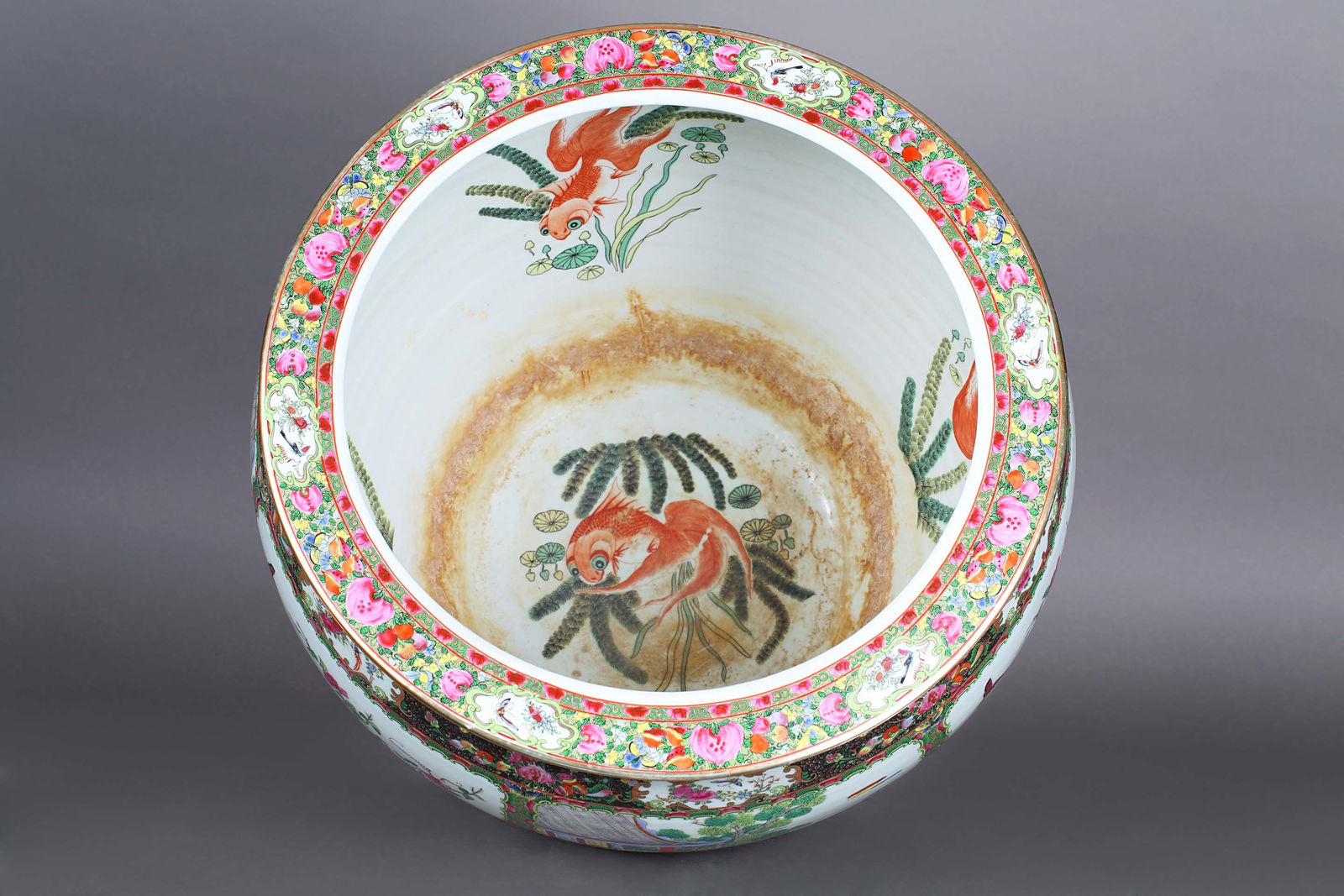 Large porcelain cache pot with floral and figurative motifs