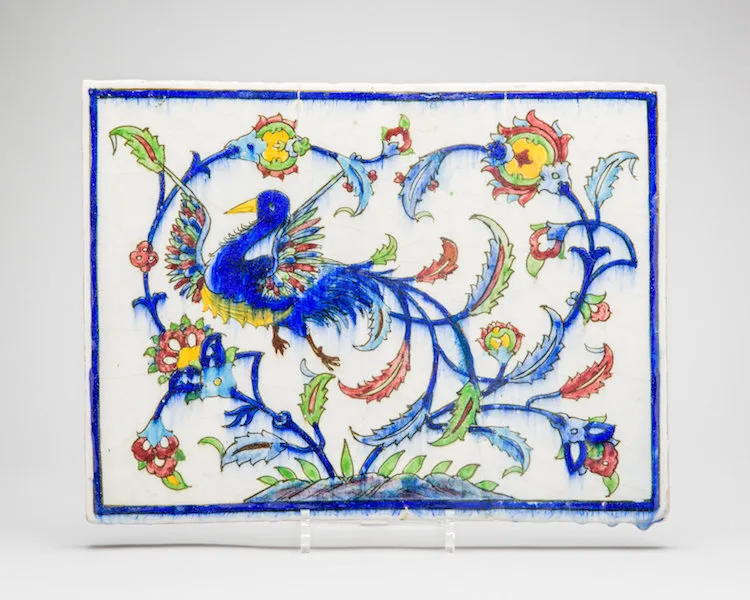 Iranian tile with bird among vegetation