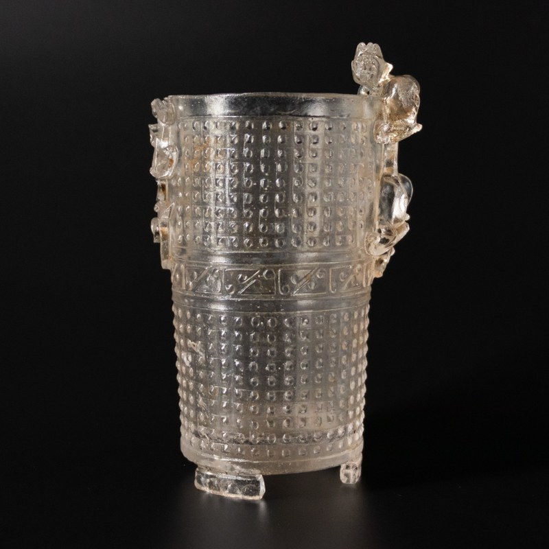 Cast glass beaker with tiger and studs, Qing Dynasty, 1644-1912