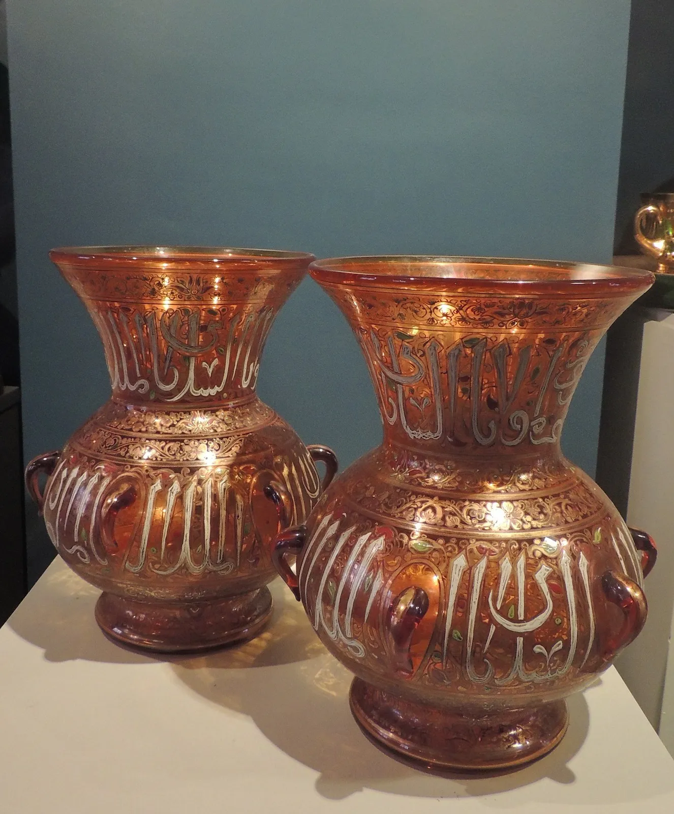 Pair of glass gilded and enamelled mosque lamps