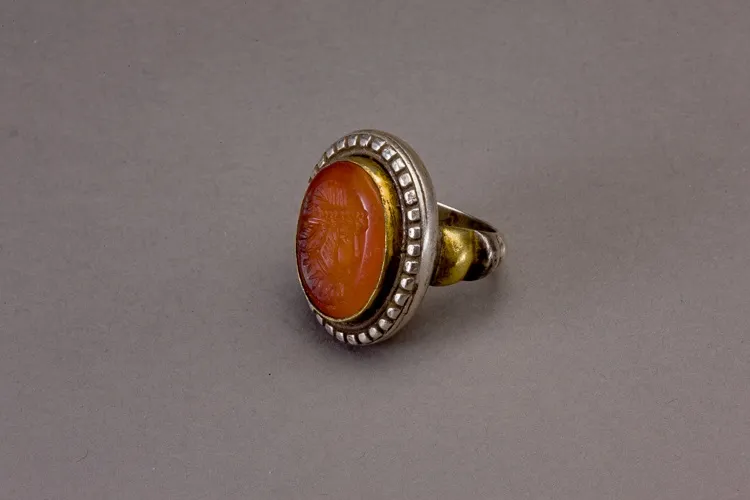Silver circular ring with carnelian intaglio in the form of a female profile to the left