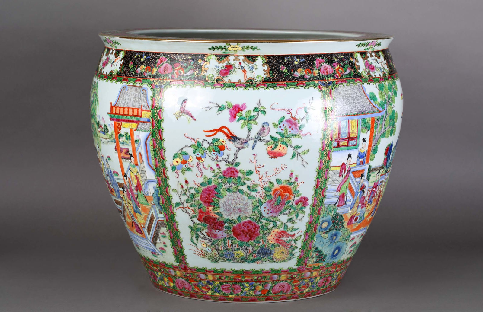 Large porcelain cache pot with floral and figurative motifs