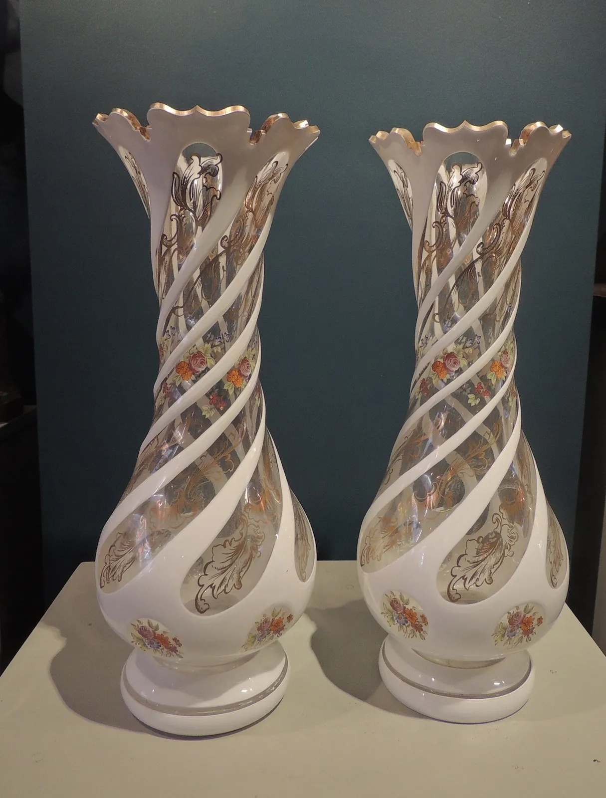 Pair of clear glass vases decorated with floral patterns