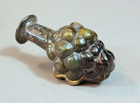 A Roman mould-blown grape flask, 100 CE - 300 CE