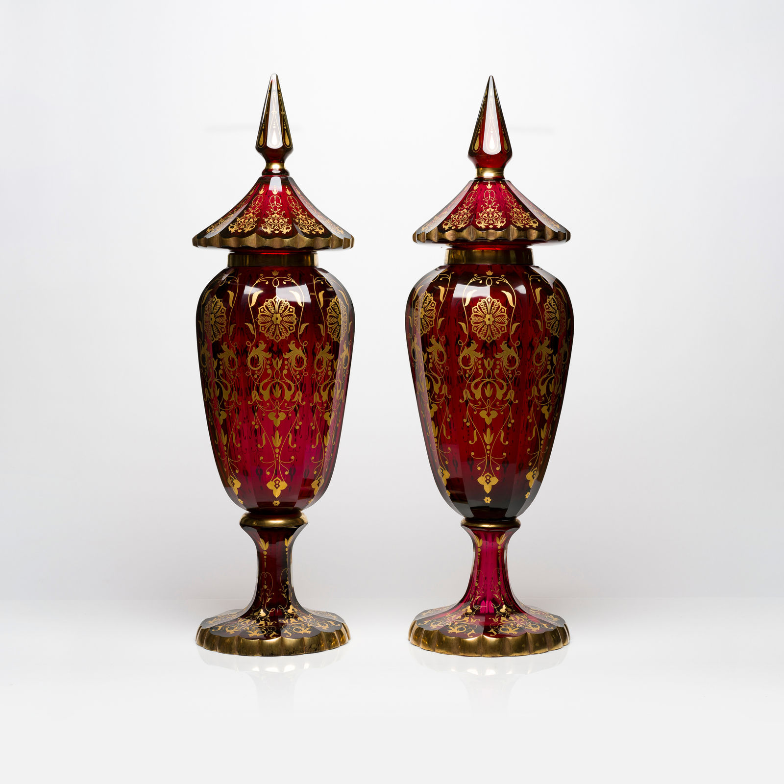A Pair of Bohemian Cranberry Glass Lidded Vases with Gold Decoration, 19th Century