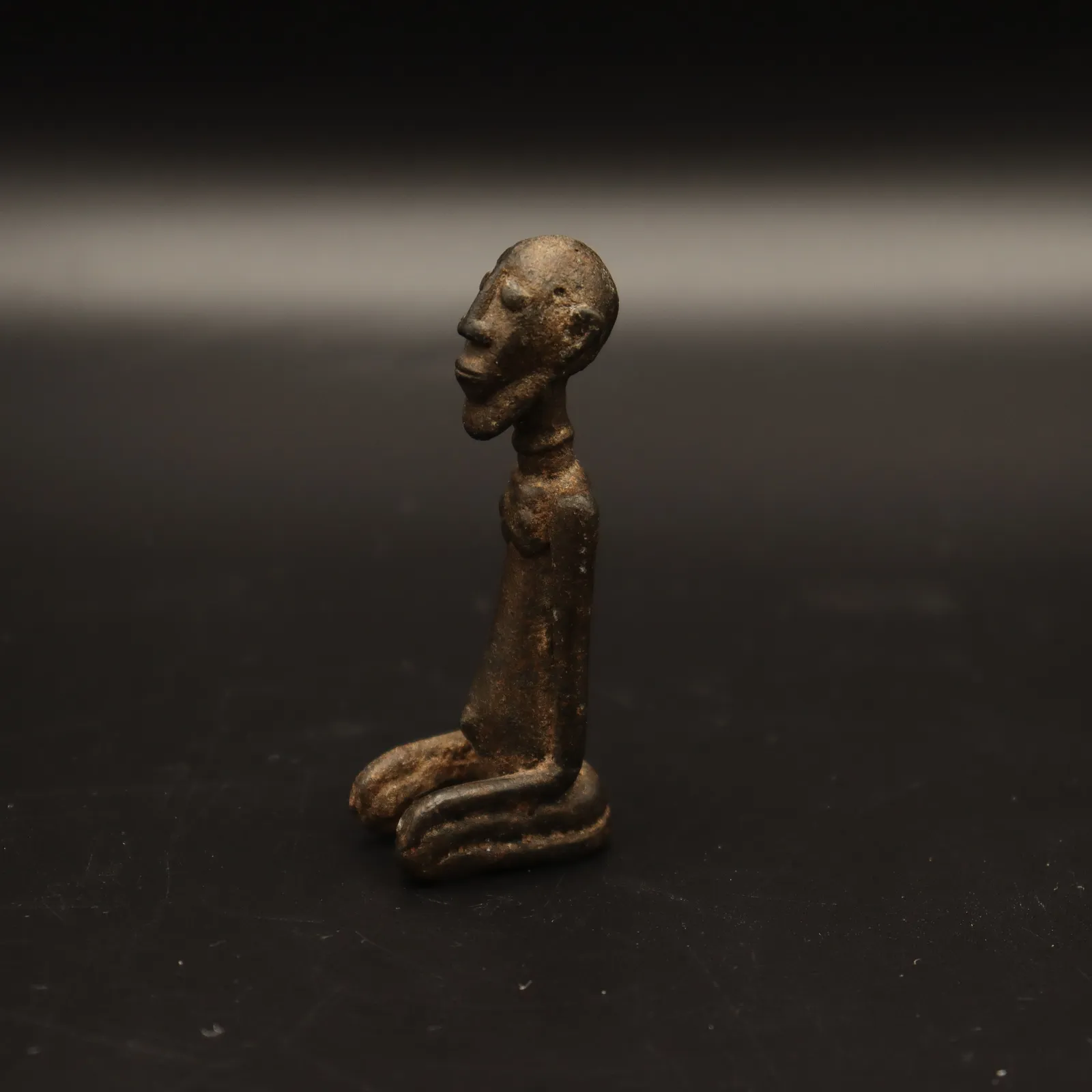 Dogon Sculpture of Kneeling Man, 14th Century CE - 15th century CE