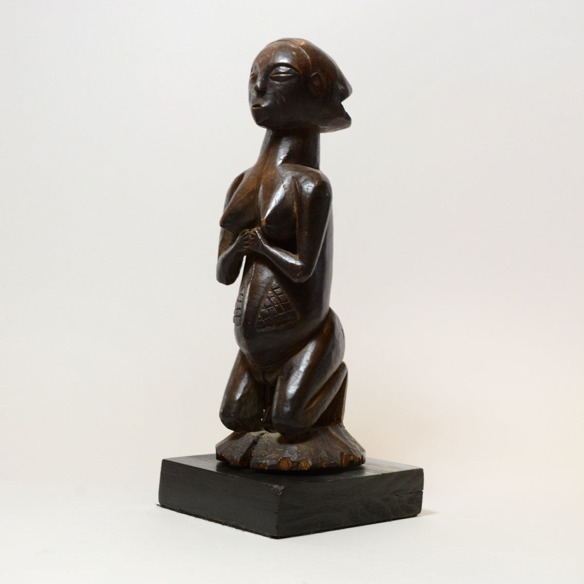 Shankadi Wooden Sculpture of a Kneeling Woman, 20th Century CE