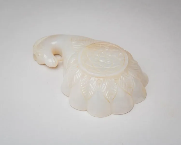 White nephrite vessel in the shape of a lotus-flower, terminating in a ram’s head