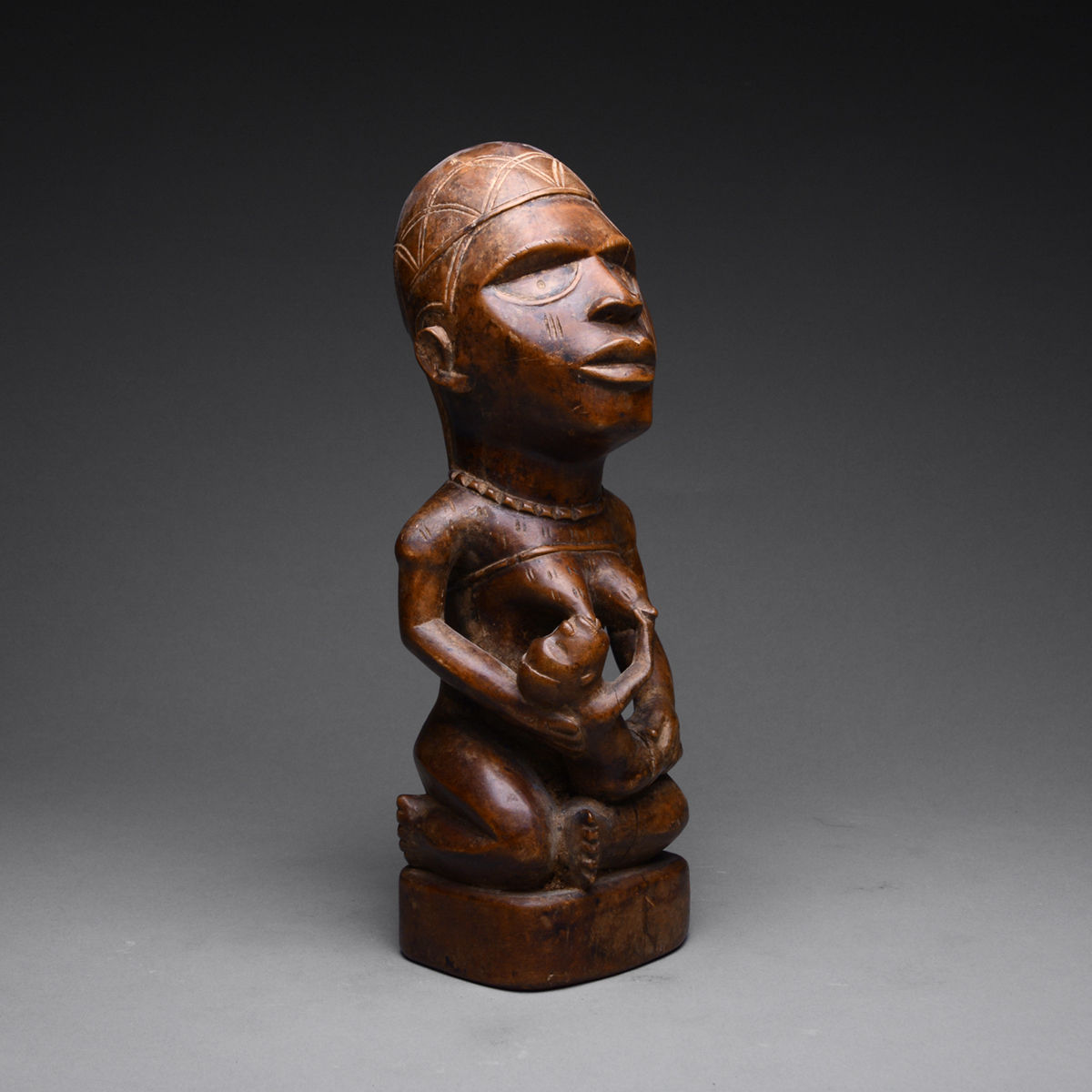 Yombe Wooden Pfemba Sculpture of a Mother and Child, 20th Century CE