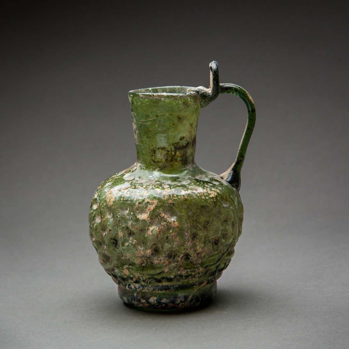 Islamic Mold-Blown Olive Green Glass Jug, 10th Century CE - 11th Century CE