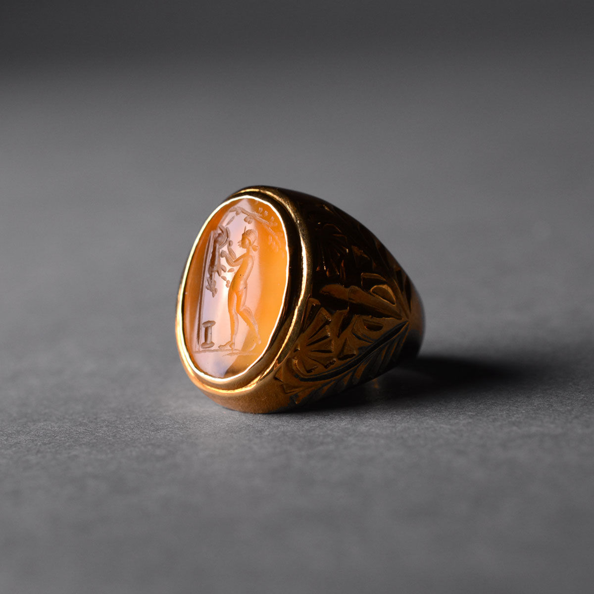 Roman Carnelian Intaglio Depicting a Man Flaying an animal, 100 CE - 300 CE