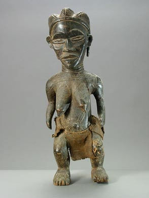 Dan Wooden Sculpture of a Woman Wearing a Skirt, 20th Century CE