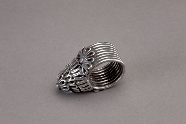 Four (4) silver bird-cage type Afghani rings