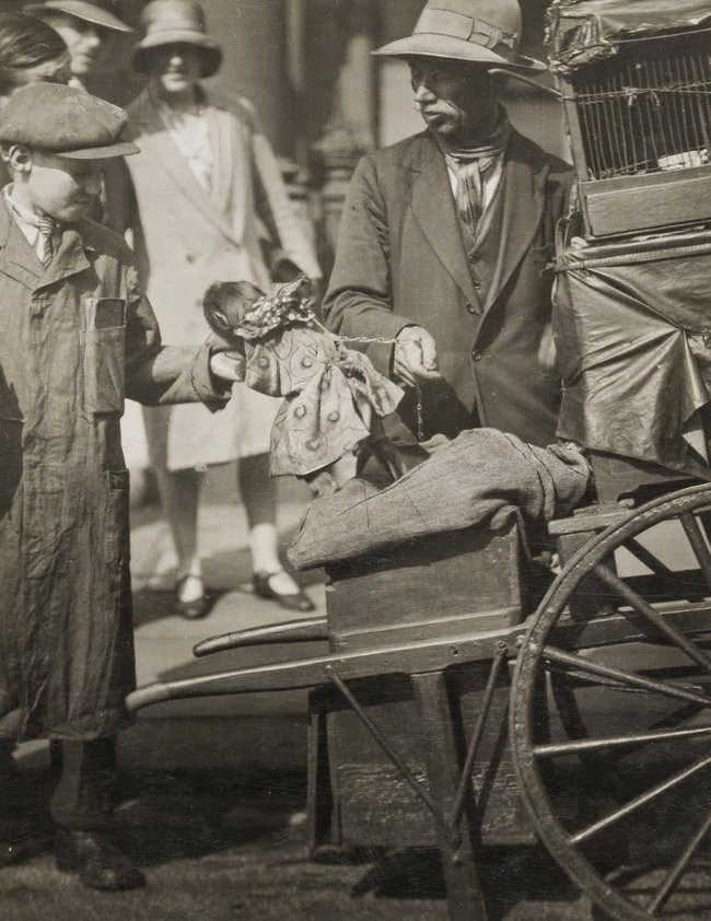 Emil Otto Hoppé, Hurdy Gurdy Man Performing with Monkey, 1929