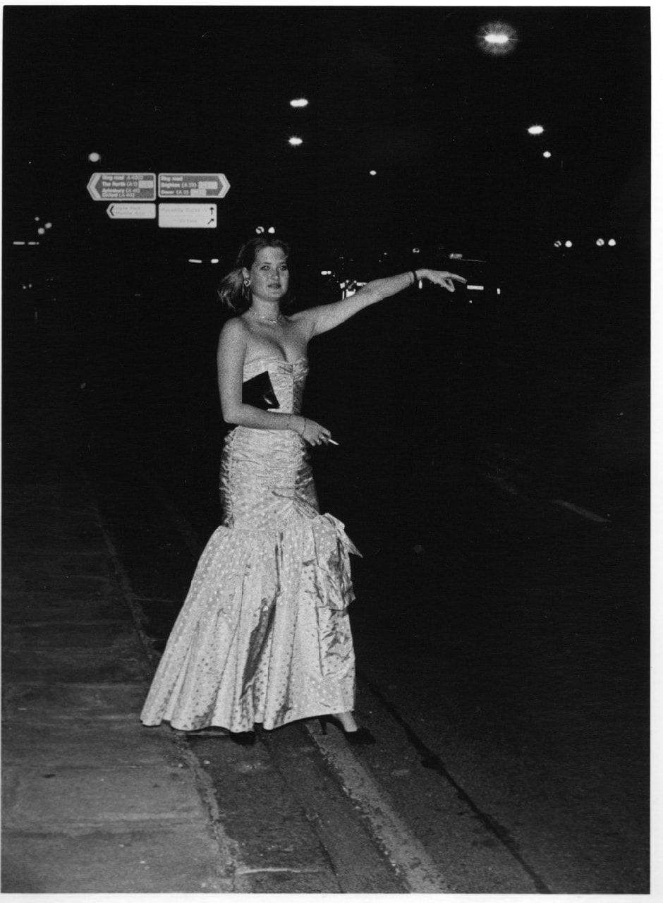 Dafydd Jones, Teenage Balls. Camilla Wigram hailing a taxi after leaving a Ball, 1985