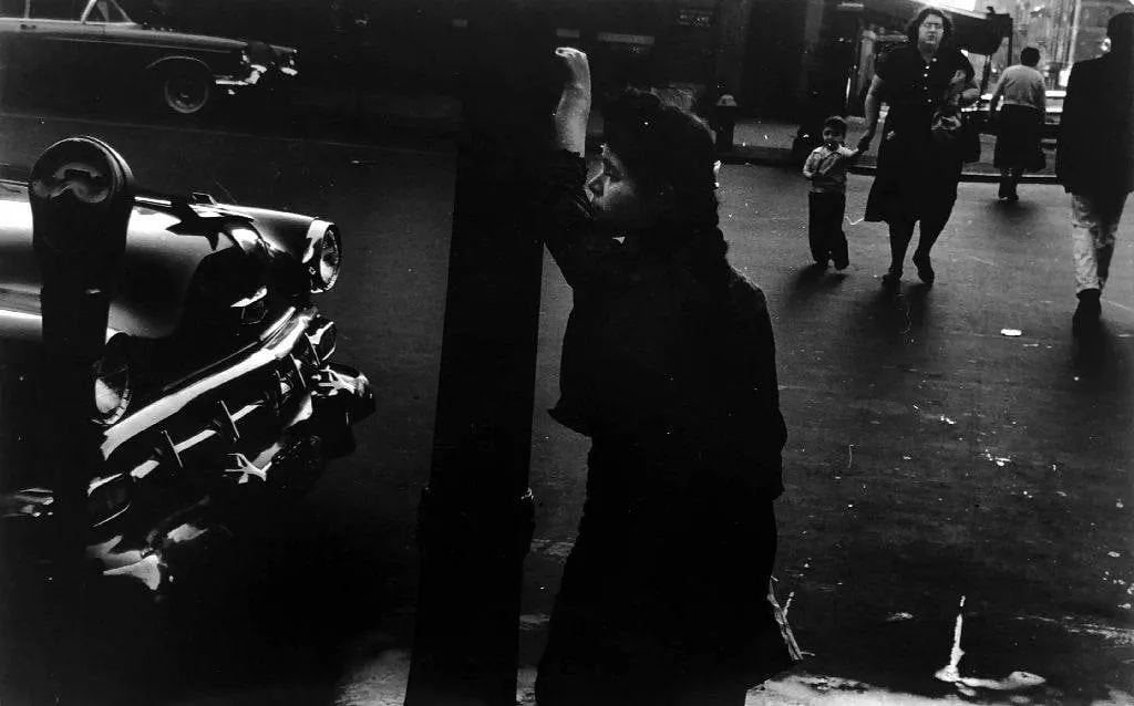 Louis Draper, Untitled (Girl leaning against pole, Chevrolet at left), New York, c. 1960s