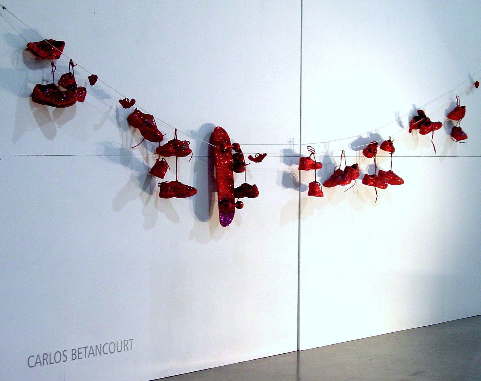 Carlos Betancourt, Interventions in Wynwood with Skateboard and Tennis Shoes hanging ( exhibit at Circa Art Fair, Puerto Rico) , 2003