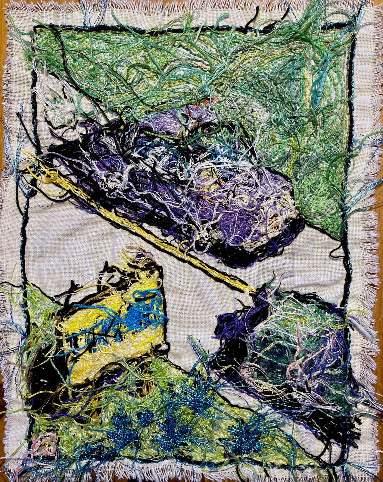 back side of emboridery showing messy stitching