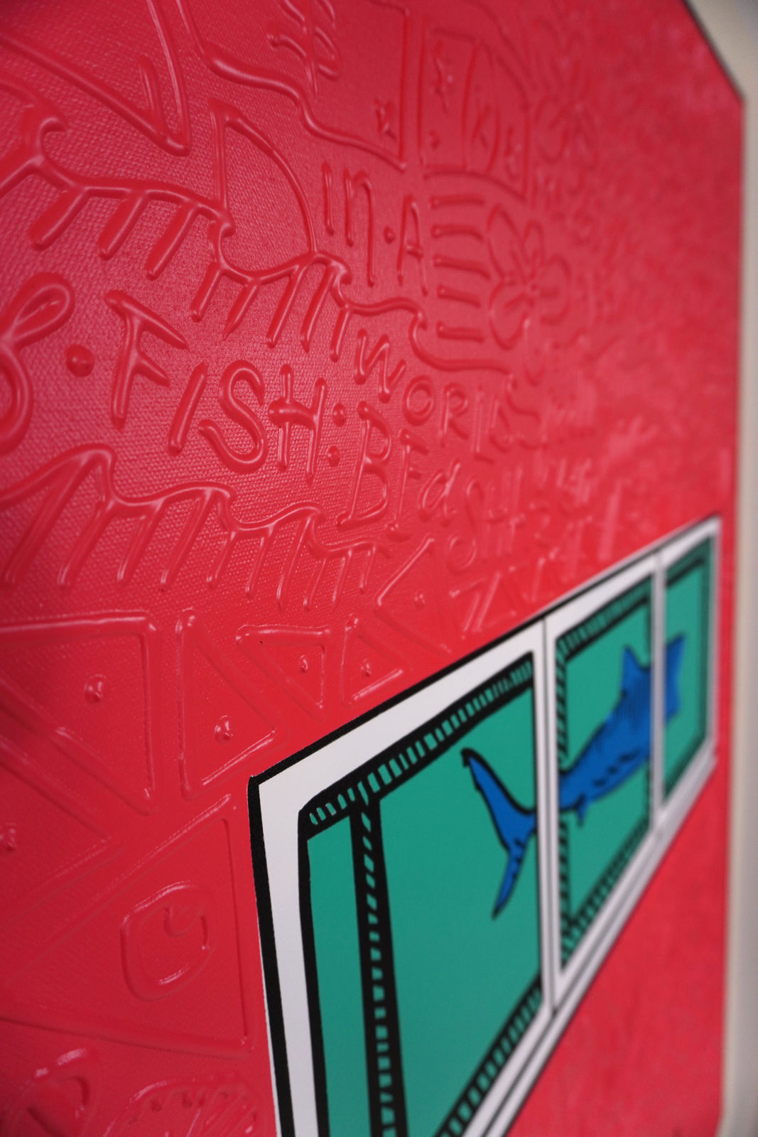 Detail photo of “El Tiburón”, painting by Cayla Birk artist from South Florida. Available at Carousel Fine Art Chicago. The artist’s technique blends traditional acrylic paints with unique materials, creating a distinct mixed media style. Birk's work is marked by intricate designs and recognizable gestures, combining contemporary culture, history, music, and literature. Her art challenges conventional thinking, offering new and unexpected experiences. Colors of this work : Red, Blue, Teal, Beige, White, Black