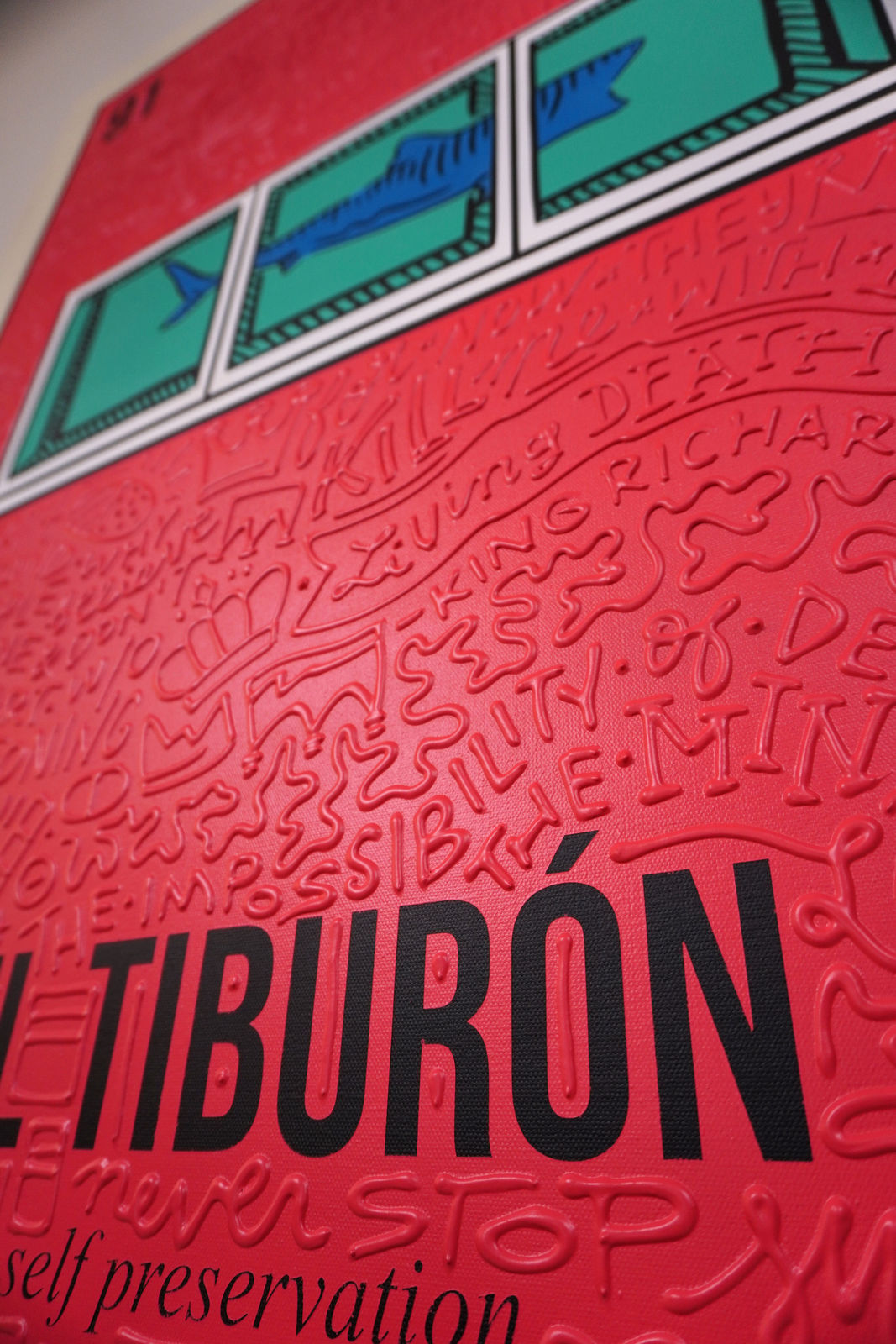 Detail photo of “El Tiburón”, painting by Cayla Birk artist from South Florida. Available at Carousel Fine Art Chicago. The artist’s technique blends traditional acrylic paints with unique materials, creating a distinct mixed media style. Birk's work is marked by intricate designs and recognizable gestures, combining contemporary culture, history, music, and literature. Her art challenges conventional thinking, offering new and unexpected experiences. Colors of this work : Red, Blue, Teal, Beige, White, Black from Florida. Available at Carousel Fine Art Chicago. The artist’s technique blends traditional acrylic paints with unique materials, creating a distinct mixed media style. Birk's work is marked by intricate designs and recognizable gestures, combining contemporary culture, history, music, and literature. Her art challenges conventional thinking, offering new and unexpected experiences. Colors of this work : Red, Blue, Teal, Beige, White, Black