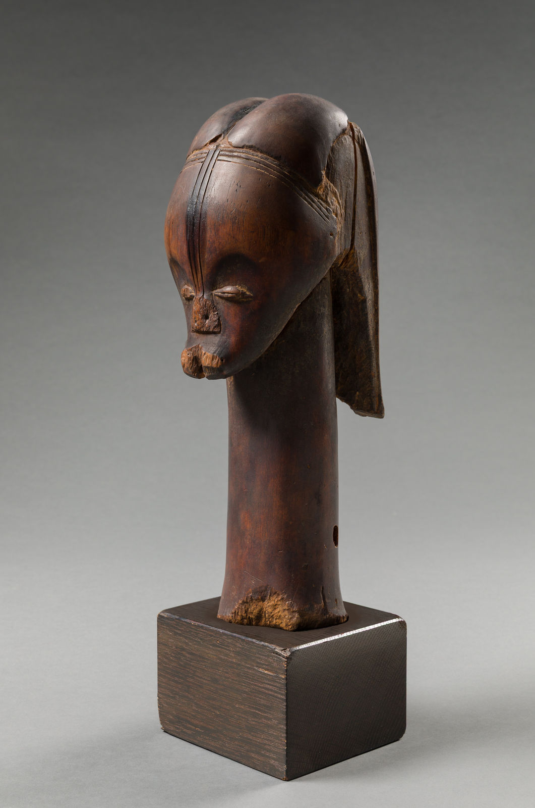 FANG ARTIST, BETSI GROUP, Reliquary head, Añgokh-Nlô-Byeri mounted on a Kichizô Inagaki (1876-1951) base, Gabon, 19th century