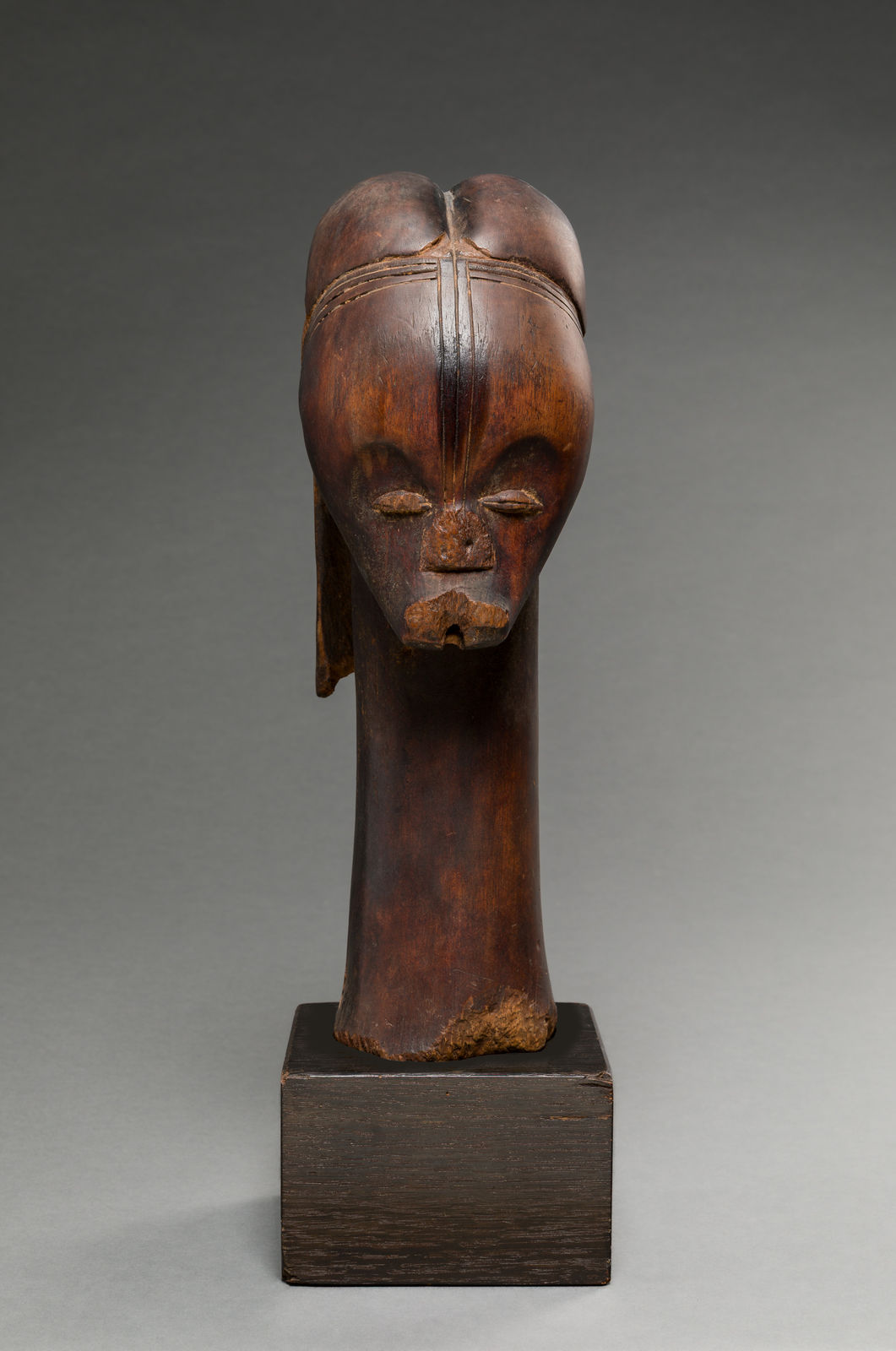 FANG ARTIST, BETSI GROUP, Reliquary head, Añgokh-Nlô-Byeri mounted on a Kichizô Inagaki (1876-1951) base, Gabon, 19th century
