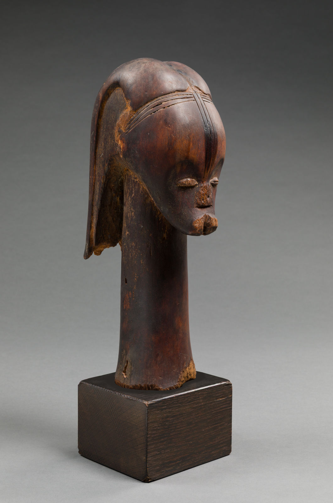 FANG ARTIST, BETSI GROUP, Reliquary head, Añgokh-Nlô-Byeri mounted on a Kichizô Inagaki (1876-1951) base, Gabon, 19th century