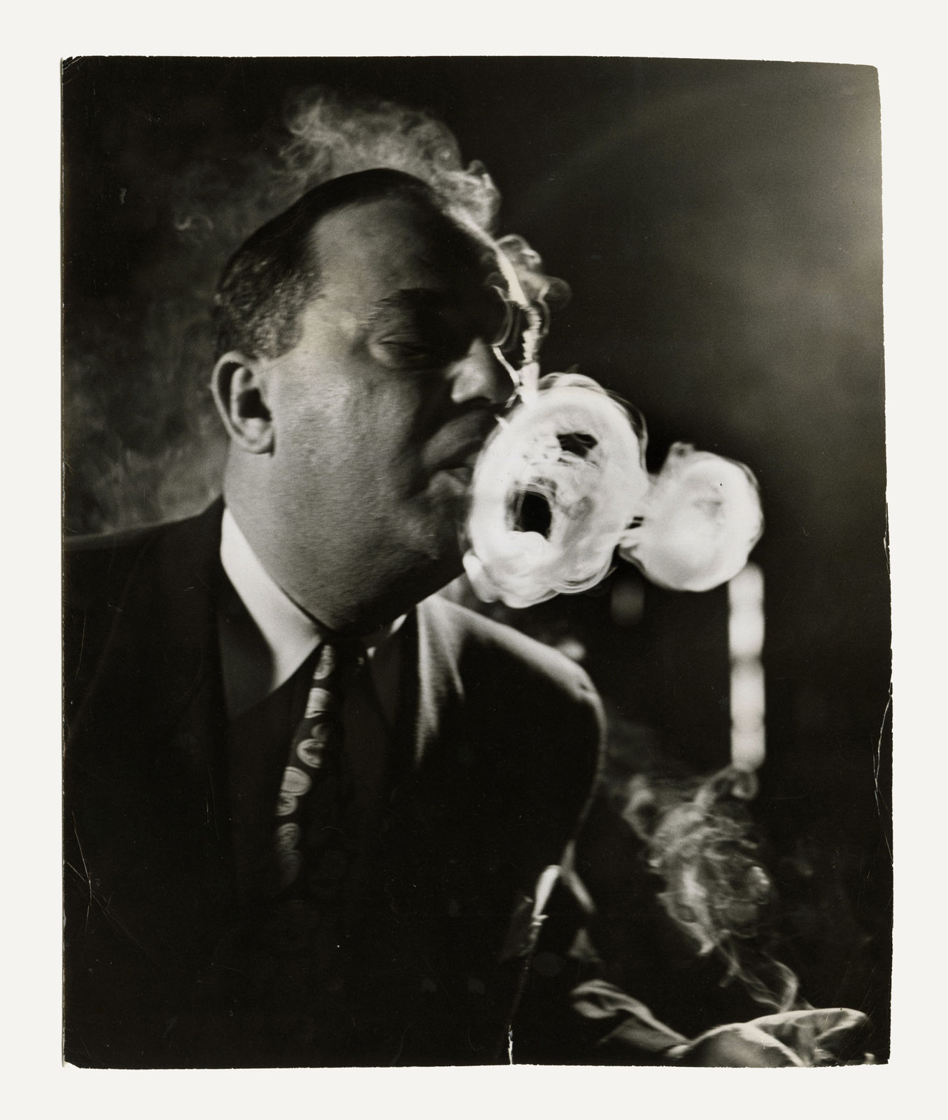 Norman J. Gordon, Three Portraits of Burt Pichol, World Champion Smoke Ring Blower, 1950s
