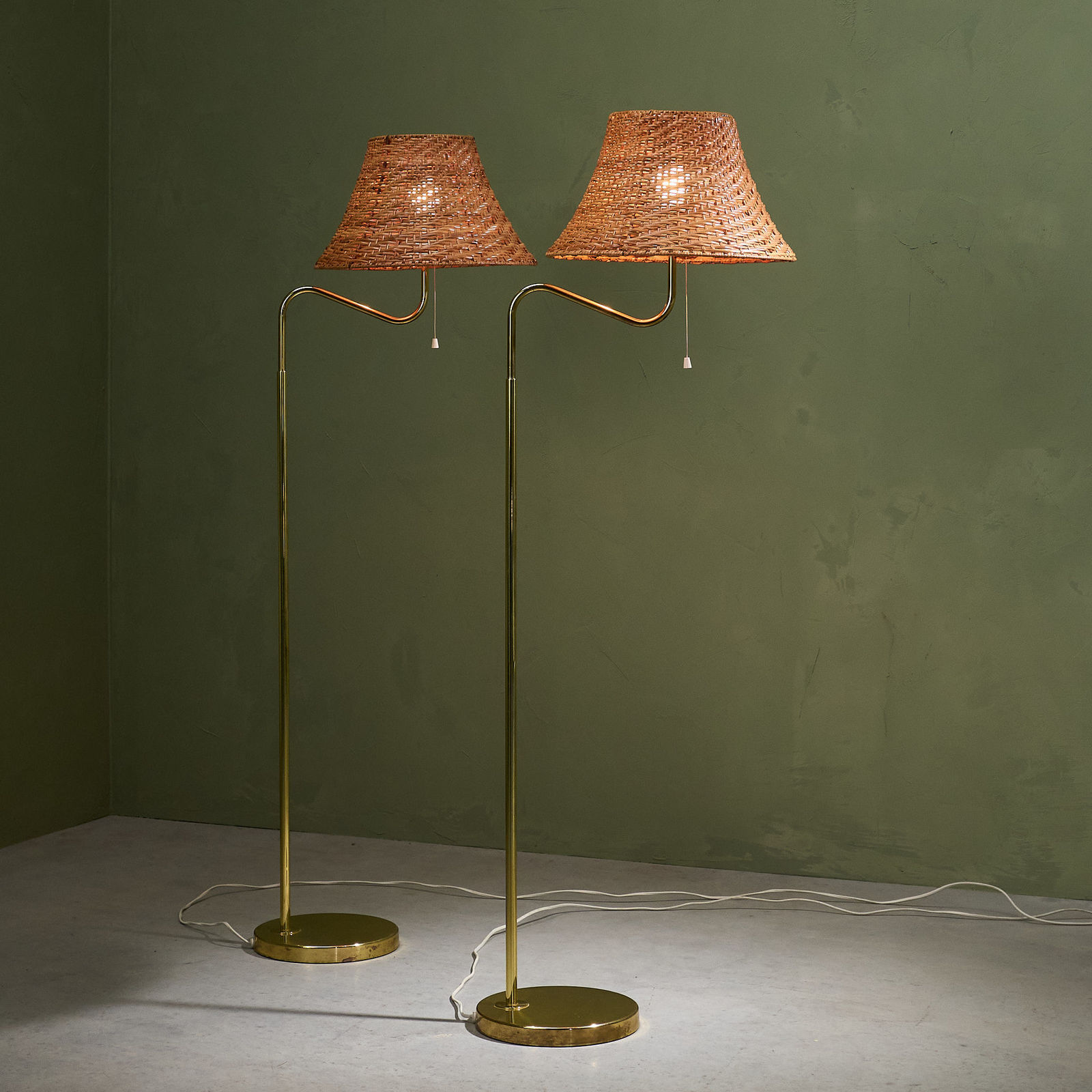 Bergboms, Pair of Floor Lamps with Rattan Shade and Curved Brass Stem, Sweden, 1960s