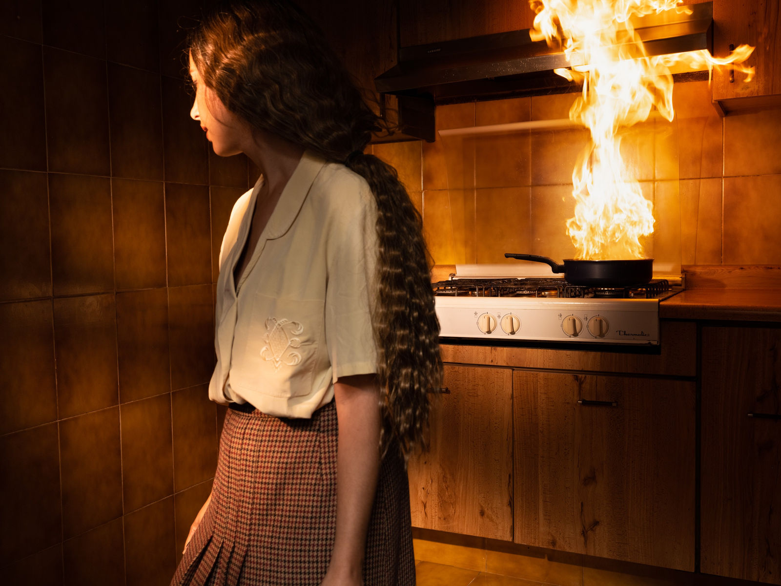 Tania Franco Klein, Pan, Fire, Kitchen (self-portrait), 2022