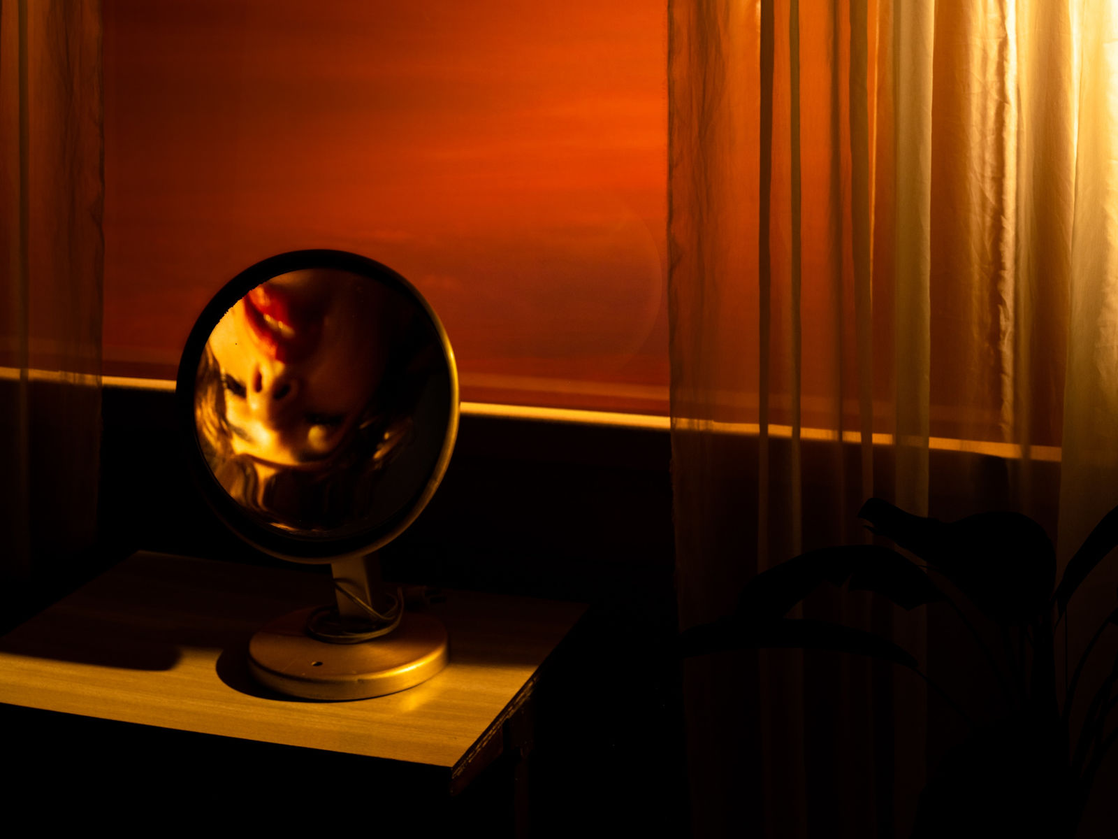 Tania Franco Klein, Break In Case Of Emergency, Rounded mirror, mirror, window (self-portrait), 2022