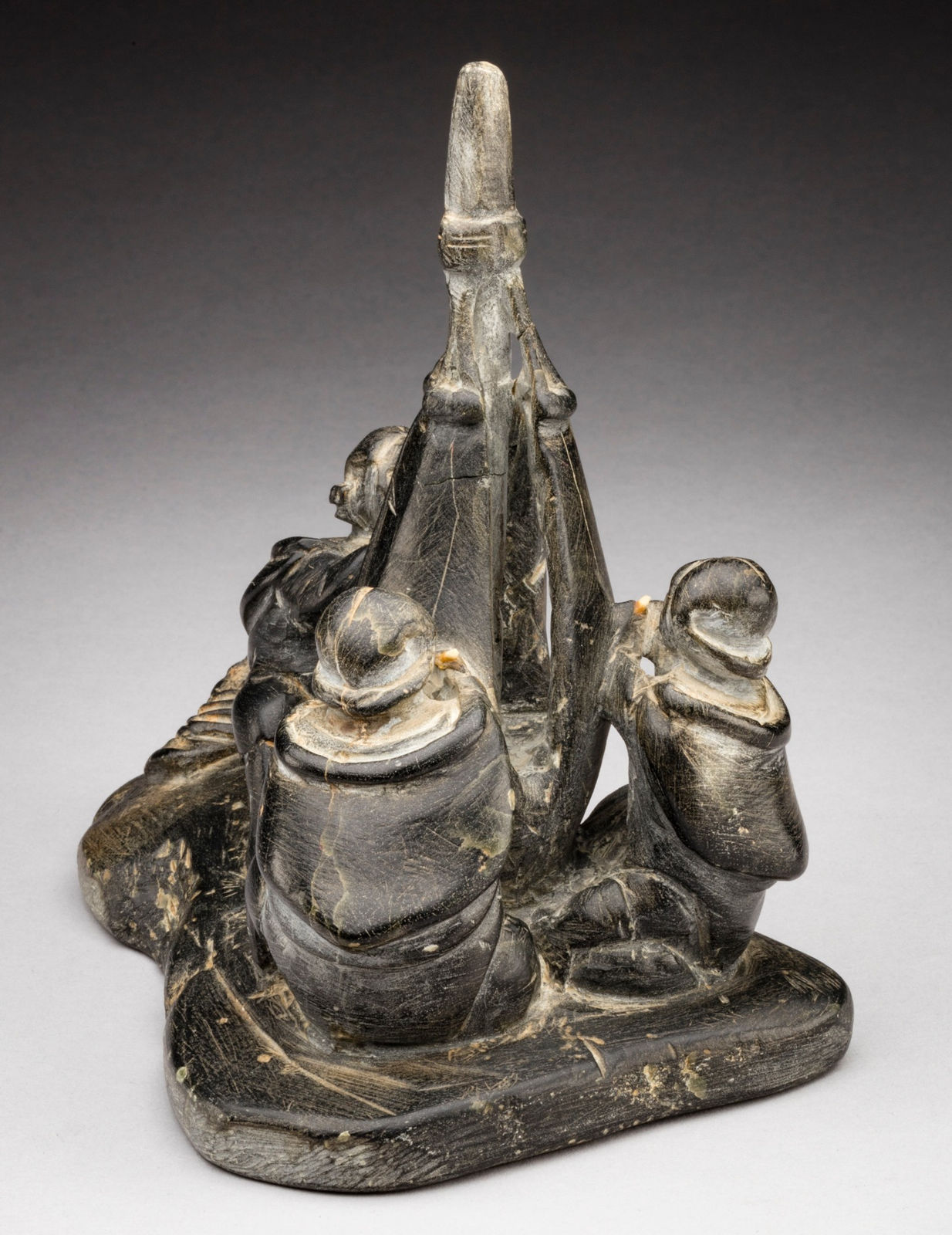 ENNUTSIAK (1893-1967) IQALUIT (FROBISHER BAY), Women Sewing Skins for a Kayak, c. 1958-60