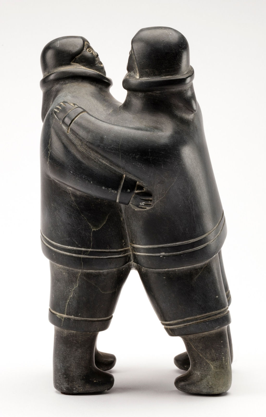 PAULOOSIE KARPIK (1911-1988) PANNIRTUQ (PANGNIRTUNG), Embracing Men, early 1960s