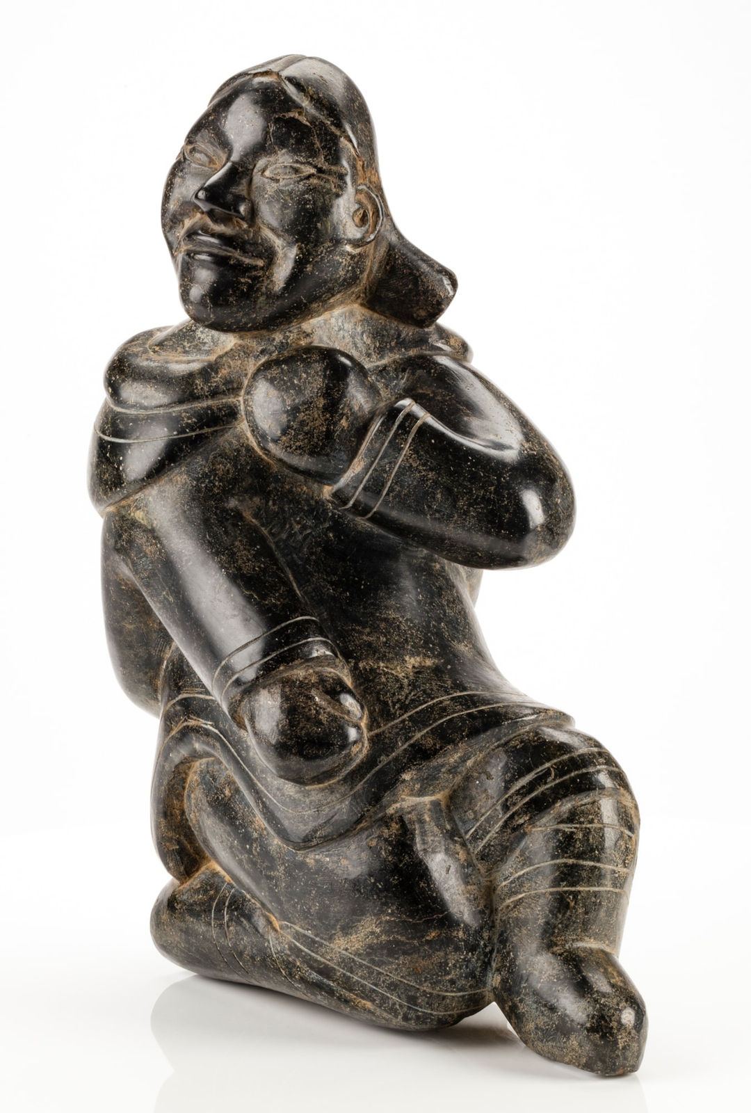 KIUGAK (KIAWAK) ASHOONA (1933-2014) or LUKTA QIATSUQ (1928-2004) KINNGAIT (CAPE DORSET), Seated Woman Adjusting Her Hood, mid 1950s