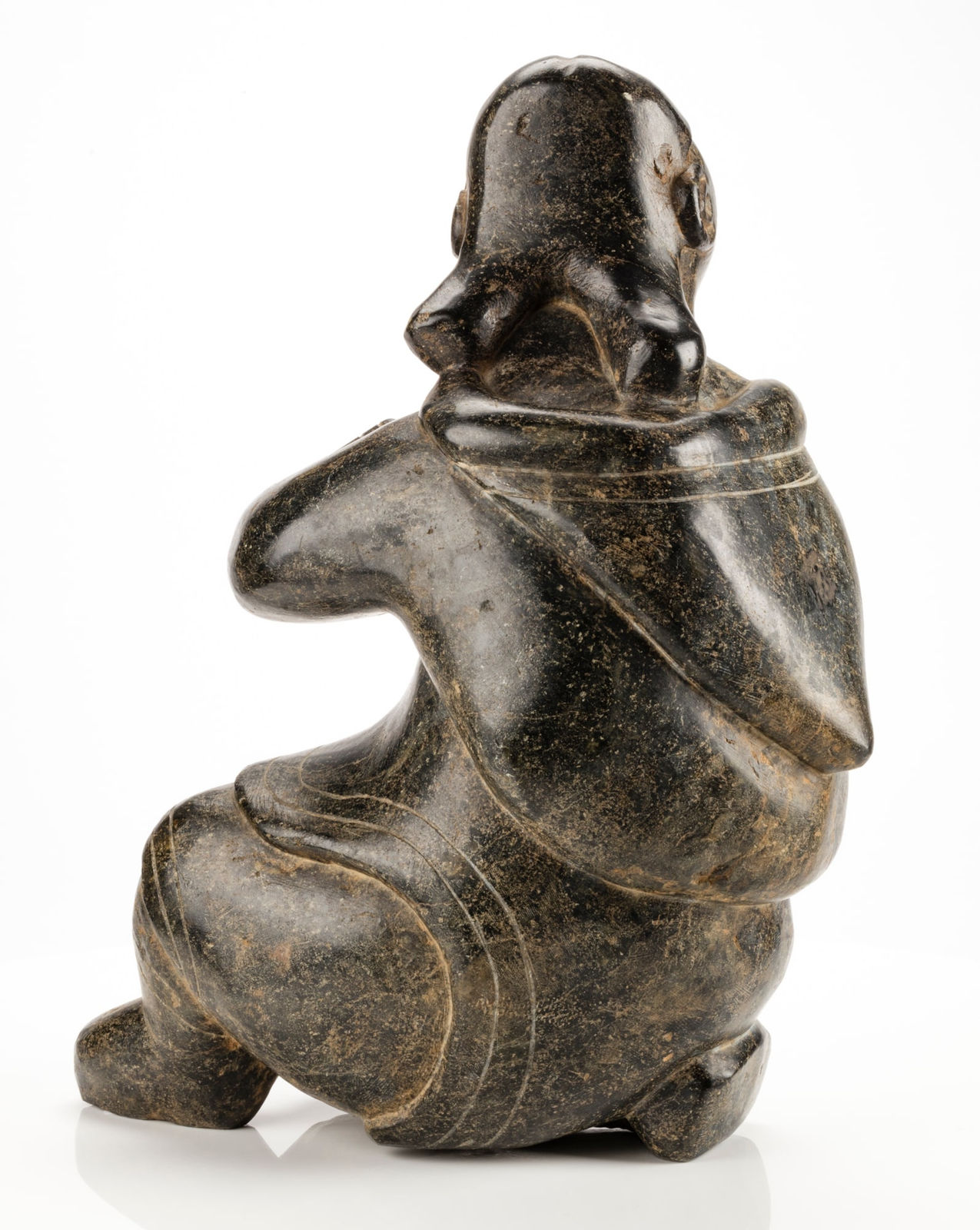 KIUGAK (KIAWAK) ASHOONA (1933-2014) or LUKTA QIATSUQ (1928-2004) KINNGAIT (CAPE DORSET), Seated Woman Adjusting Her Hood, mid 1950s