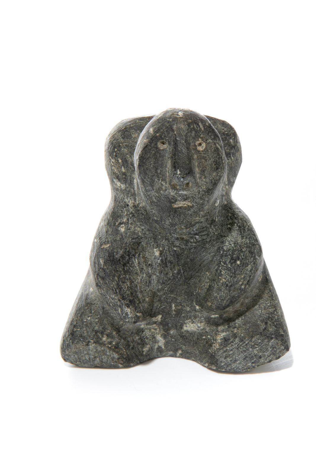 MARC ALIKASWA (1928-2008) ARVIAT (ESKIMO POINT), Seated Man with Pack, late 1980s