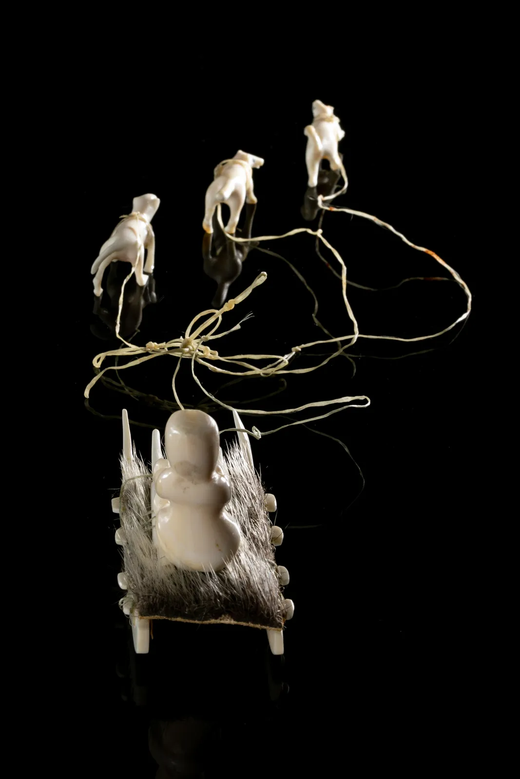 UNIDENTIFIED INUIT ARTIST, EASTERN CANADIAN ARCTIC, Hunter on Qamutiq (Sled) with Qimmiit (Sled Dogs), c. 1980