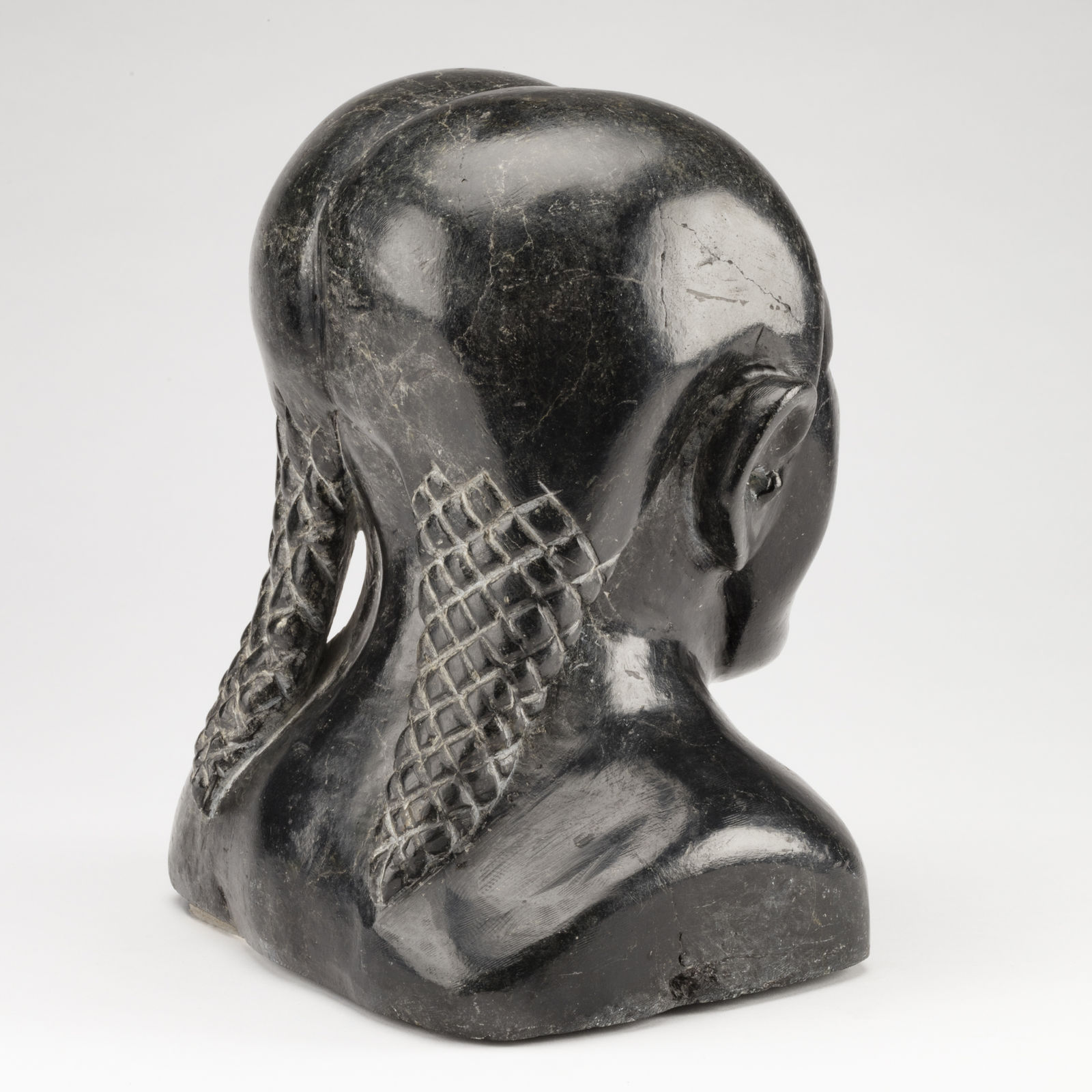 SYOLLIE (SAROLLIE) WEETALUKTUK (1906-1962) m., INUKJUAK (PORT HARRISON), Bust of a Young Woman with Plaited Hair, c. 1960