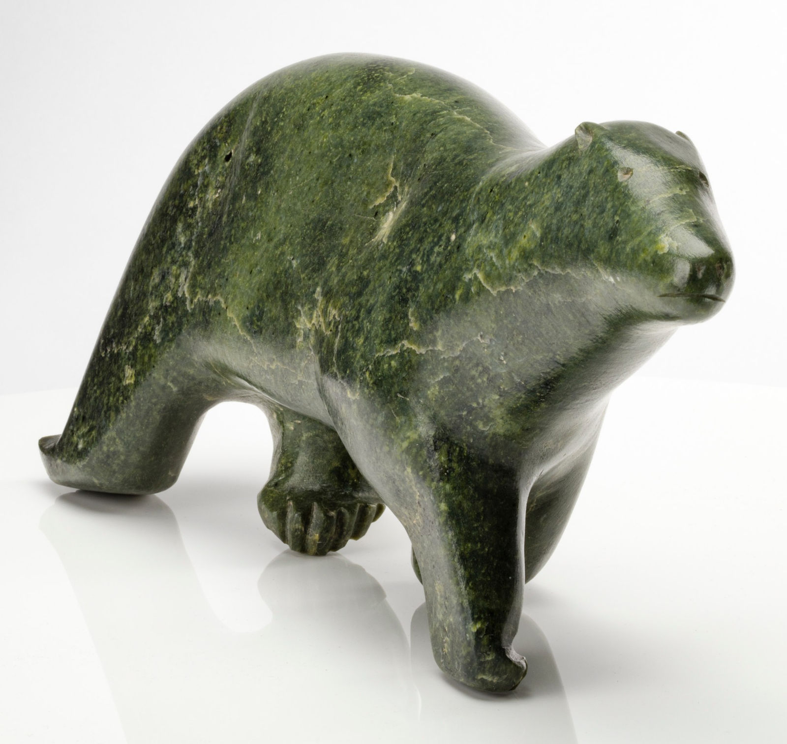 PAUTA SAILA, R.C.A. (1916-2009) KINNGAIT (CAPE DORSET), Striding Polar Bear, c. 1962