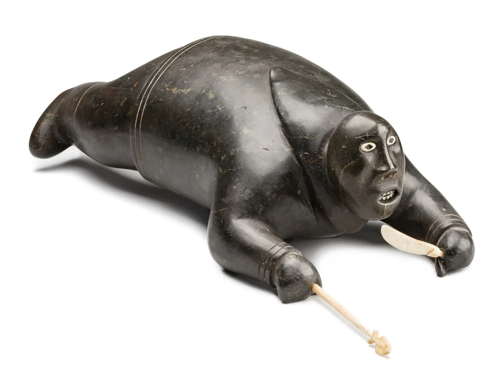 Attributed to JOHNNY INUKPUK, R.C.A (1911-2007) INUKJUAK (PORT HARRISON), Crawling Hunter with Knife and Spear, c. 1952