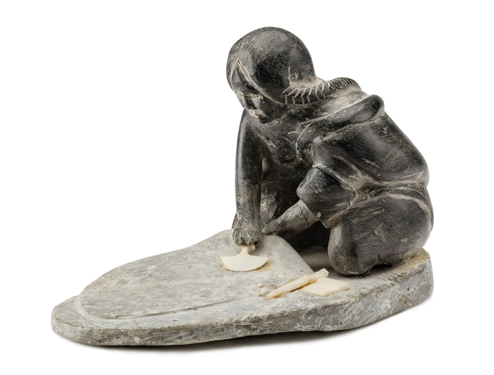 ENNUTSIAK (1893-1967) IQALUIT (FROBISHER BAY), Woman Preparing a Skin, c. late 1950s