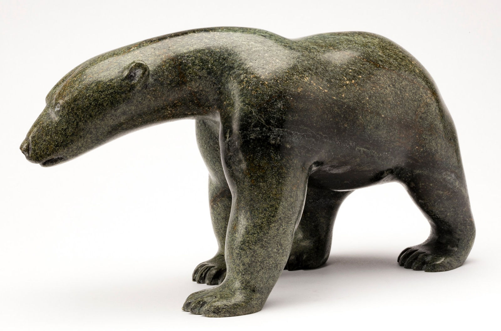 HENRY EVALUARDJUK (1923-2007) IQALUIT (FROBISHER BAY), Walking Polar Bear, c. 1980