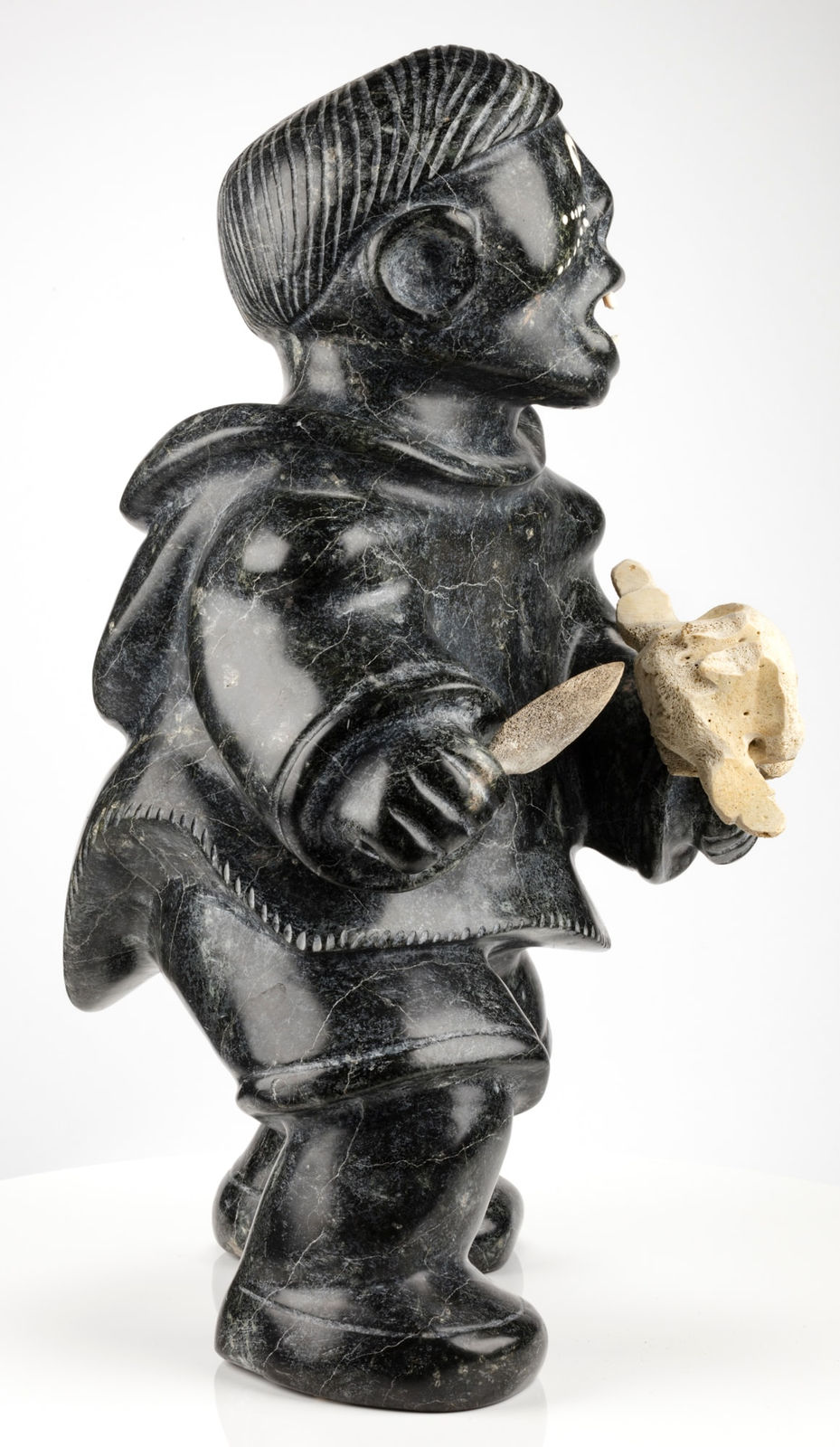 NELSON TAKKIRUQ (1930-) Uqsuqtuuq (Gjoa Haven), Tattooed Woman Holding Mask, 1988