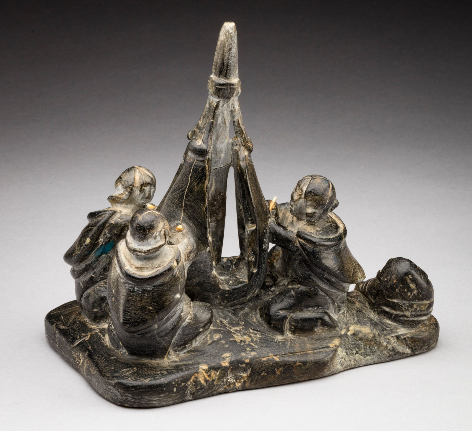 ENNUTSIAK (1893-1967) IQALUIT (FROBISHER BAY), Women Sewing Skins for a Kayak, c. 1958-60