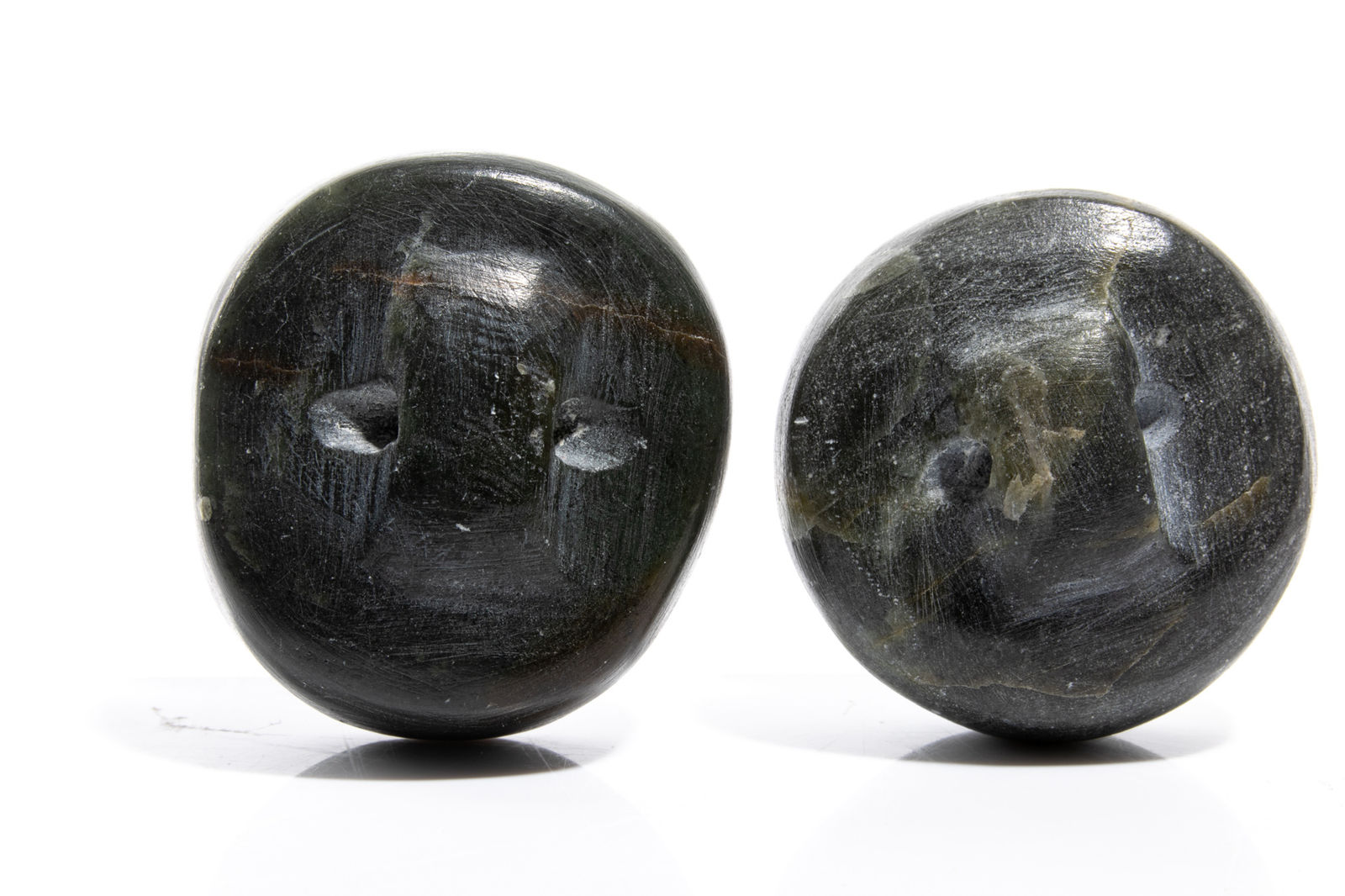 UNIDENTIFIED ARTIST INUKJUAK (PORT HARRISON), Two Buttons, Decorated with Faces of an Inuk, c. 1975