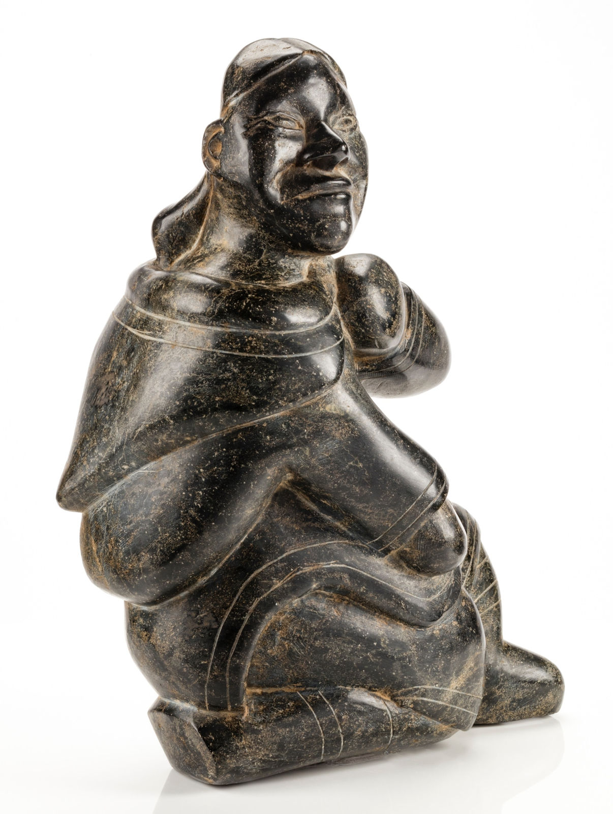 KIUGAK (KIAWAK) ASHOONA (1933-2014) or LUKTA QIATSUQ (1928-2004) KINNGAIT (CAPE DORSET), Seated Woman Adjusting Her Hood, mid 1950s