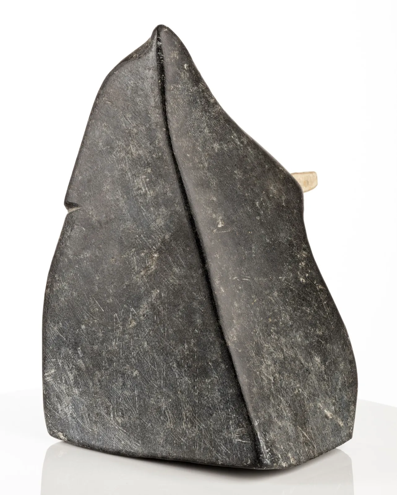 JOHN PANGNARK (1920-1980) ARVIAT (ESKIMO POINT), Figure Holding an Implement, c. 1972