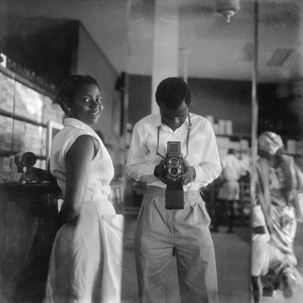 James Barnor, Self-portrait with a store assistant at the West African Drug Company, central Accra, 1952